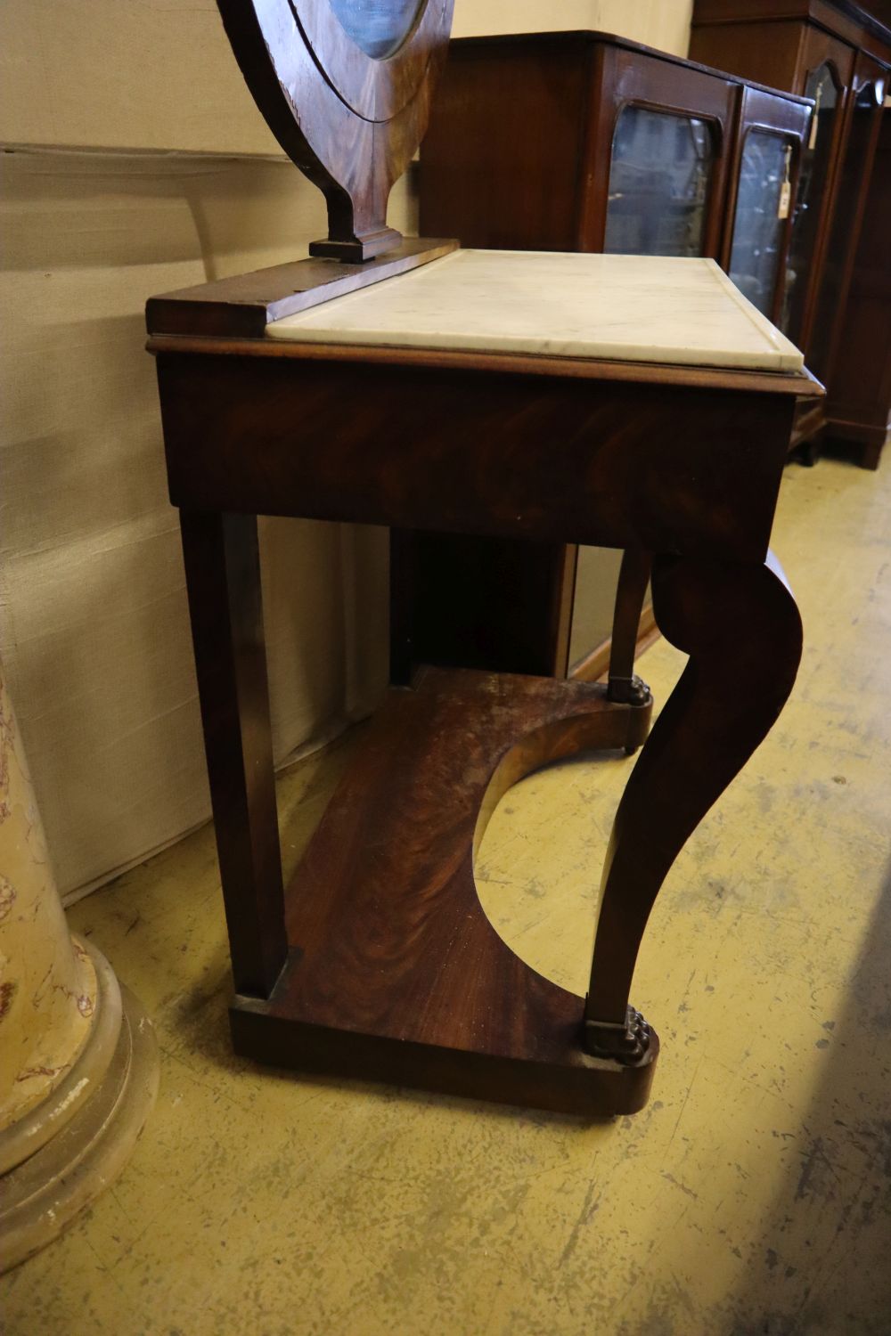 An Empire style dressing table, width 79cm, depth 45cm, height 145cm